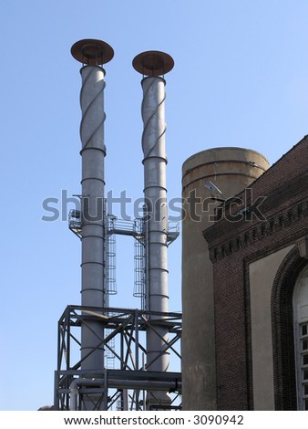 Power Station with two exhaust stacks against blue sky