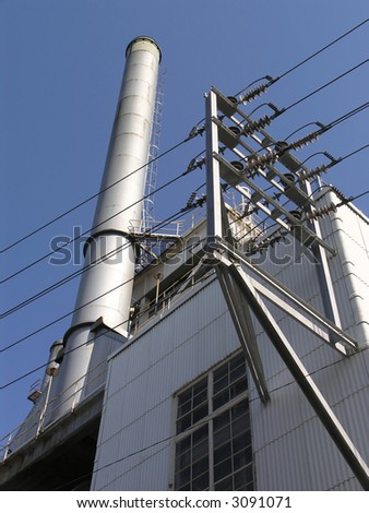 Power Station with one exhaust stack against blue sky