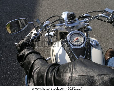 Close up of chrome motor cycle and rider