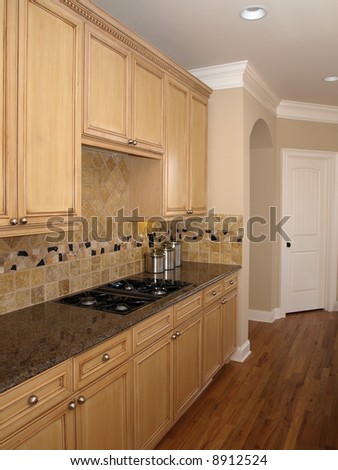 Luxury Kitchen with light colored wood