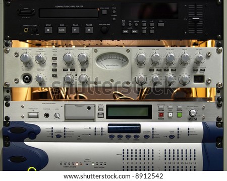 Professional audio equipment components on rack