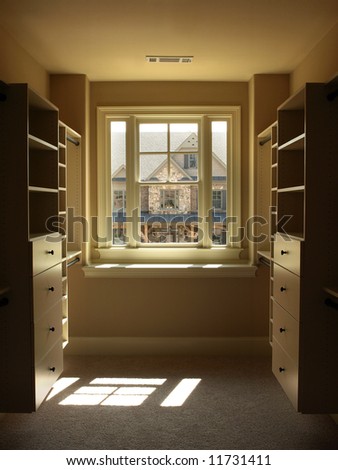 Luxury Walk in Closet with window and shelves