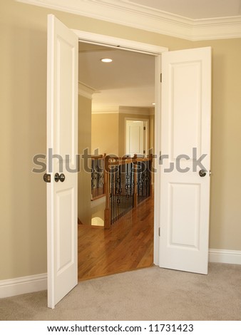 Open Double Door to Stairwell and hard wood floors