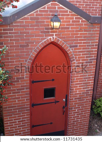 Red Brick Arch Door with light over head
