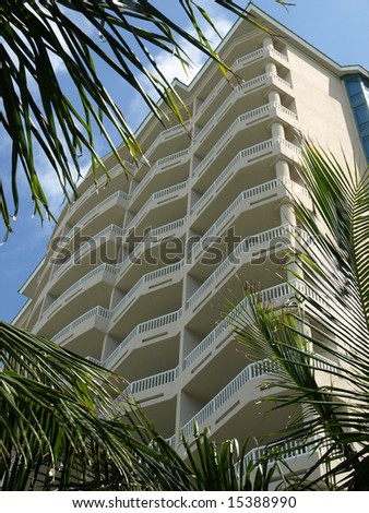 Beach Resort Front with Green Palm Fronds