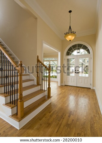 Luxury Home Staircase and Foyer with hanging light