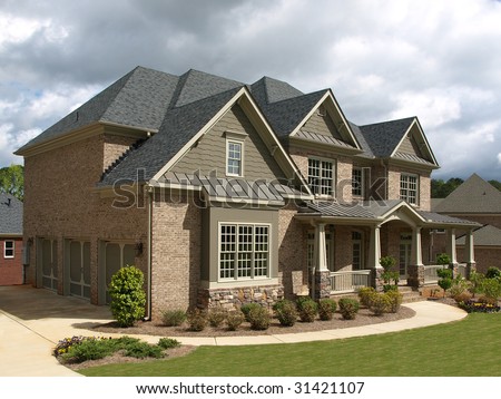 Luxury Model Home Exterior stormy weather angle view