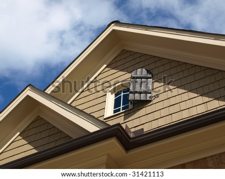 Luxury Model Home Exterior with window attic close up