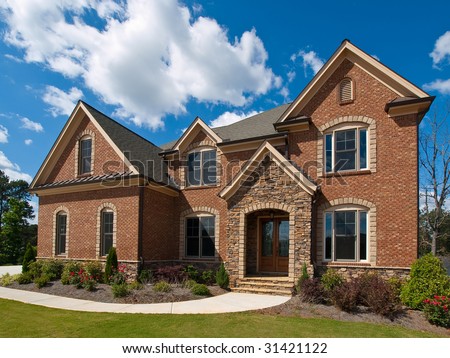Model Luxury Home Exterior with clouds side view