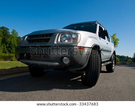 Silver Sports Utility Vehicle low angle view SUV