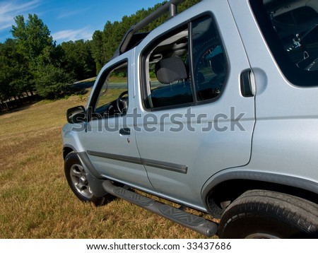 Silver Sports Utility Vehicle side panel view