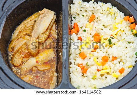 Meat curry with rice in black box