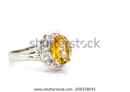 Yellow sapphire ring on white