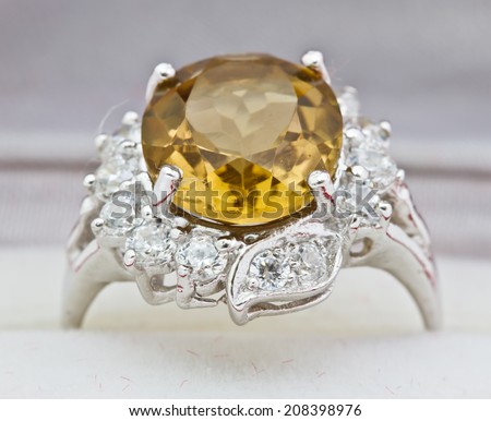 Yellow sapphire ring on white
