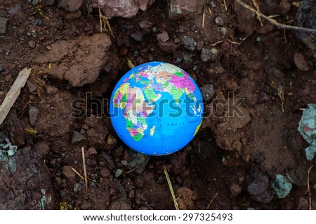 earth planet on dry soil. Elements of this image furnished by NASA