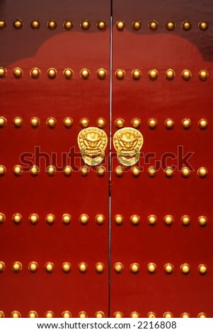 A traditional red door at Temple of Heaven in Beijing, China.