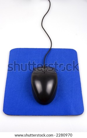 A black computer mouse with mouse pad.