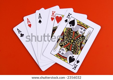 stock-photo-a-full-house-poker-game-on-red-background-2356032.jpg