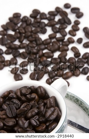 A cup of coffee bean in white background.