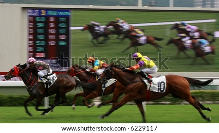 The Horse Racing at Hong Kong Jockey Club, big screen on the background. (got some noise due to high ISO and slight blurry for motion effect)