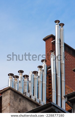 chimney pipes on a residential buildings roofs