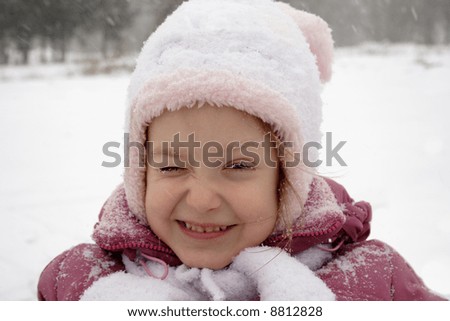 close-up of child with snow-covered eyelashes