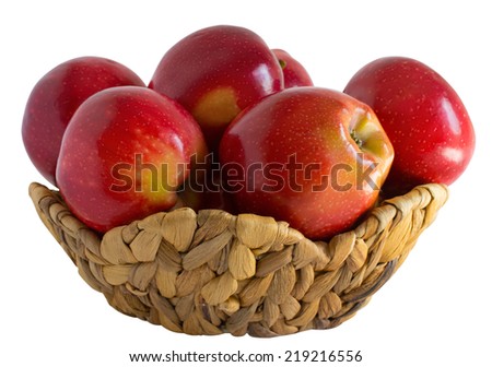 Six red ripe apples in the basket isolated on white background