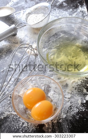 egg yolks in a bowl, over bakery or pastry background