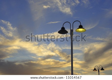 Street Lamp Of public Illumination Lighted In Los Angeles During Sunset