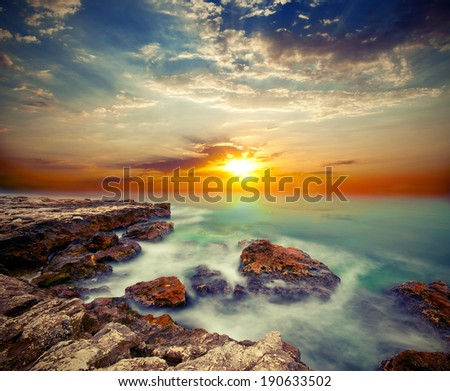 Sea cliffs and sunset over the sea. Vintage style