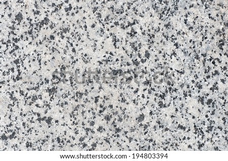Gray with small black granite inserts. natural texture