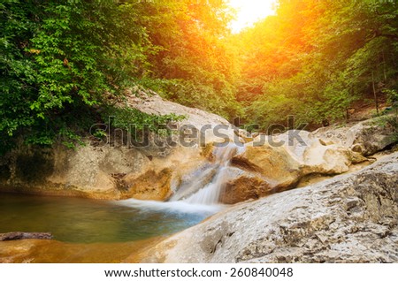 River deep in mountain forest. Natural composition