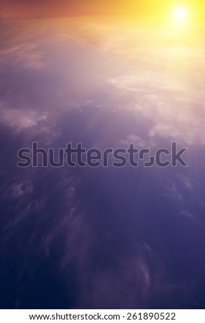 The sun rises above the clouds and bright rays. Breaking Dawn. natural composite