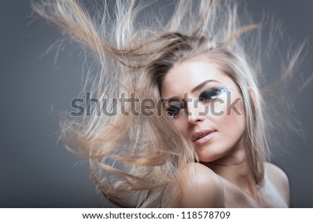 Beauty shot of a young pretty blond with flowing hair