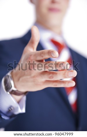 Businessman ready to make a deal with hand in focus