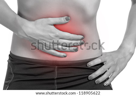 Woman suffering from stomach pain, isolated in white.