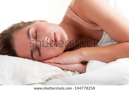 Woman sleeping in the clouds and dreaming