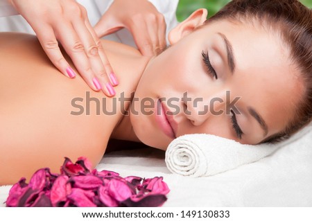 Young woman lying in a spa ready to get a massage