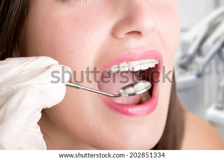 Closeup of a dentist hands about to do a procedure on a patient