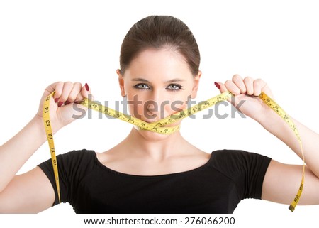Woman with a yellow measuring tape around her mouth, isolated in white
