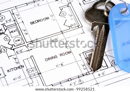 House blueprint with a key on top of it