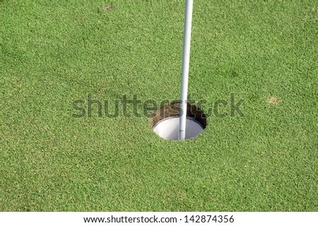 green with flag in the hole.