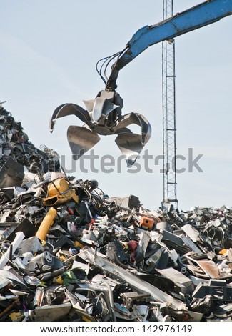 Scrap metal, iron and computer dump with crane.