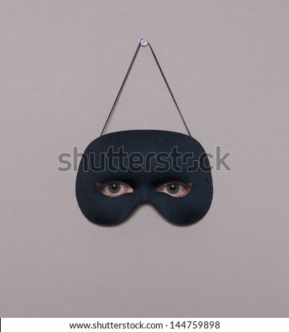eyes behind a black mask