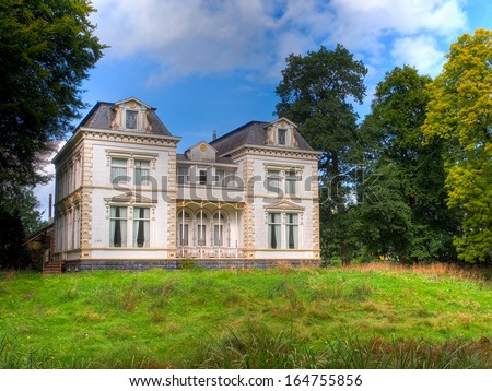 Historic White Mansion in Green Countryside