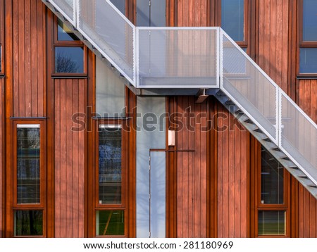Escape stairs on a sustainable wooden office building background