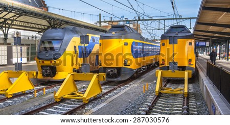 Three large intercity trains on Central Station in Groningen waiting at the platform to leave for Amsterdam. The intercity trains are an important and reliable connection between the north and west