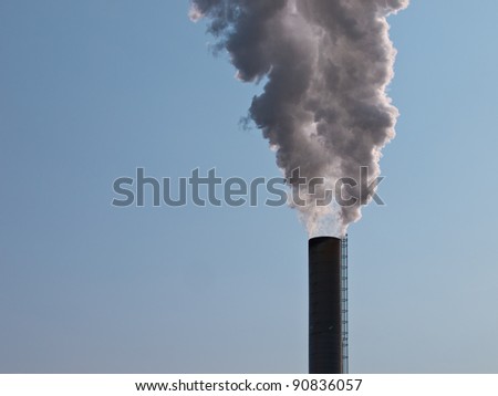 Smoking chimney representing economic growth