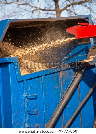 Wood Chipper Machine Filling Back Of Truck With Mulch