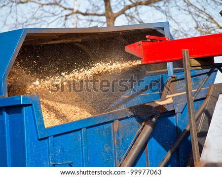 Wood Chipper Machine Filling Back Of Truck With wood chips